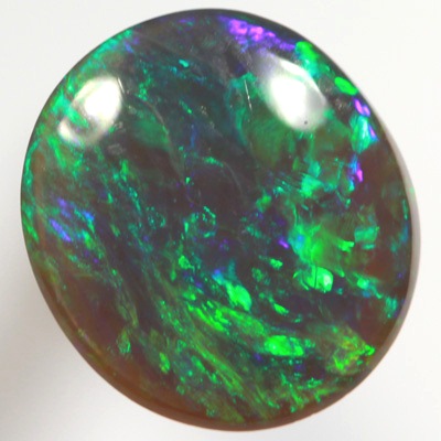 SOLID BLACK OPAL Bright gemmy fire in a Green Harlequin pattern SEE VIDEO